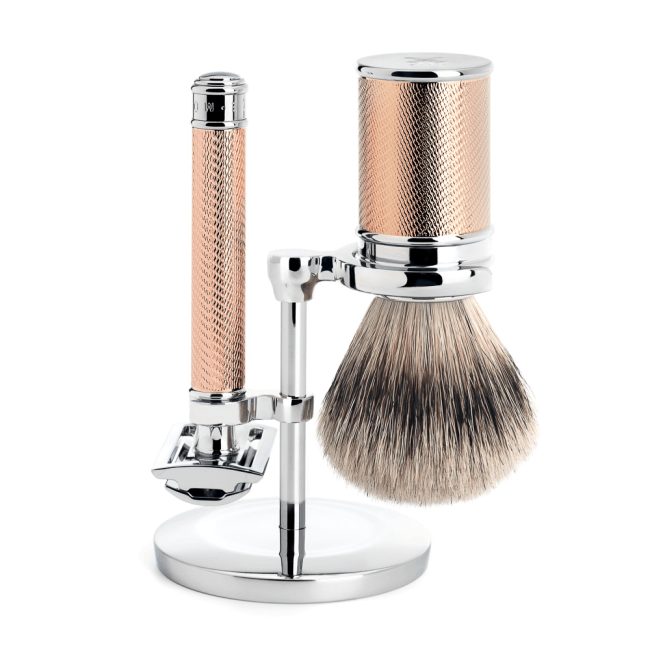 Set de rasage Mühle TRADITIONAL, rasoir de sûreté et blaireau à manches en métal doré rose, sur support chromé